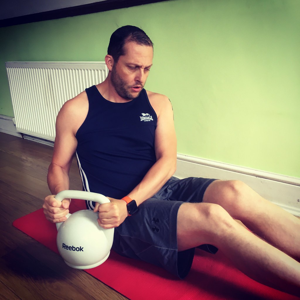 helpful expercise form formula 1 workout - Russian twist